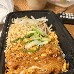 a tray of noodles and rice
