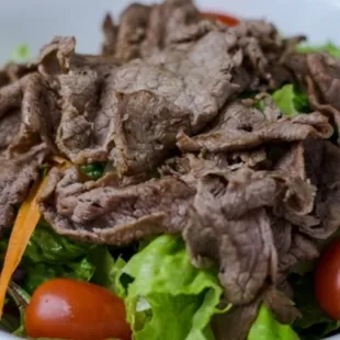 a close up of a bowl of salad