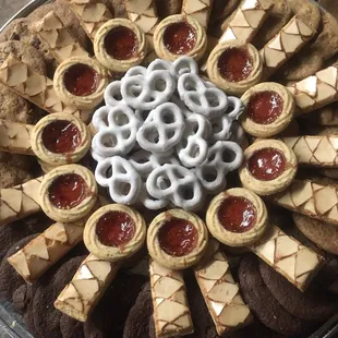 a platter of cookies and pretzels
