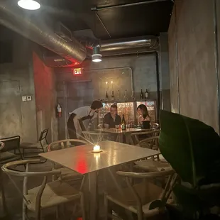 two people sitting at a table in a restaurant