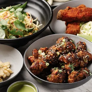 a variety of dishes of food on a table