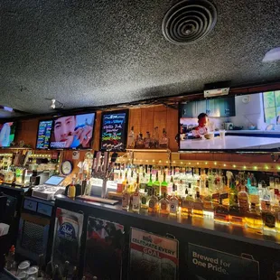 a bar with multiple televisions