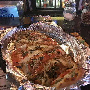 Pesto margherita flatbread.  Absolutely delicious. Highly recommend.