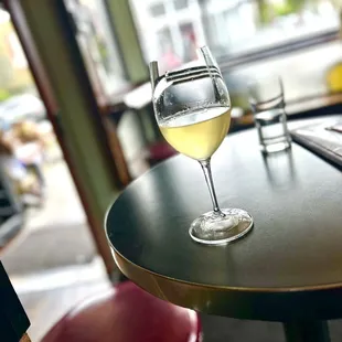 a glass of wine on a table