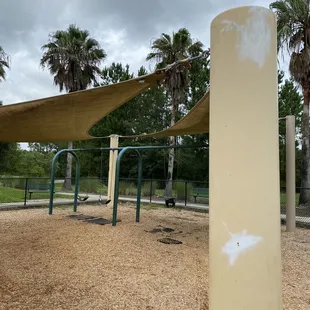 Swing set area on playground. Needs fresh paint