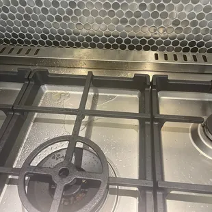 Water and grease that poured out of the hood.