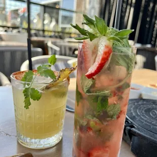 Pineapple Serrano margarita and strawberry muddled mojito