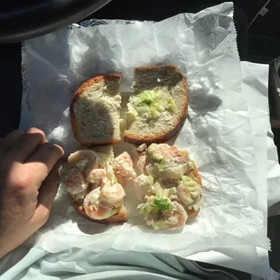 a sandwich with shrimp and lettuce
