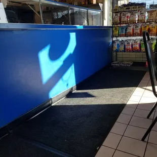 a view of a blue counter and chairs