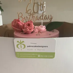 a pink cake in a box