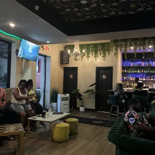 a group of people sitting in a living room