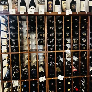 a wine rack full of wine bottles