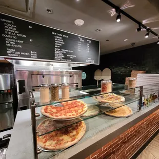 pizzas on display in a restaurant