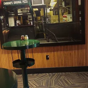 a pizza place with a green table