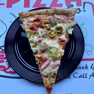 Slice so big it's hanging off the plate