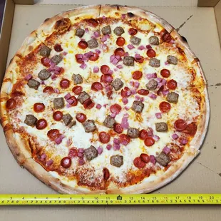 Whole Meat Pizza ($33). Tape measure for reference.