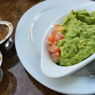 a bowl of guacamole and salsa