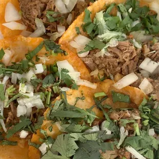 two tacos in a styrofoam container