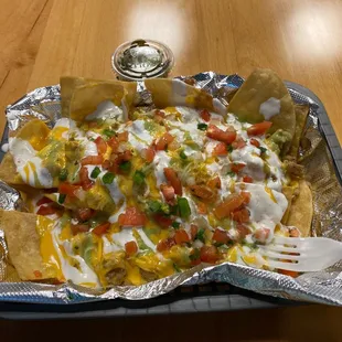 Half order of chicken nachos...get in my belly!