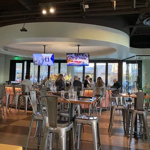 the inside of a restaurant with tables and chairs