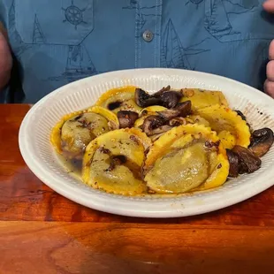 a plate of ravia and mushrooms