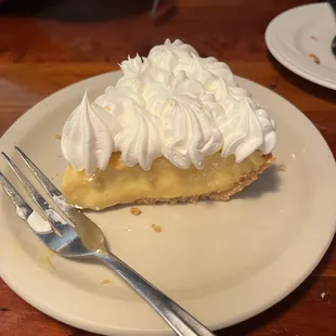 a slice of pie with whipped cream