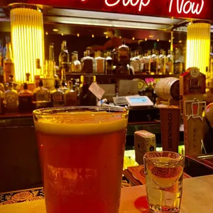 a glass of beer on a table