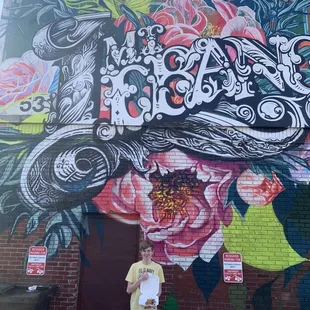 My buddy in front of the mural outside