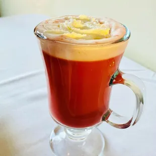 Cherry blossom tea with milk, sugar, cardamom, and whipped cream! Better than a cocktail!