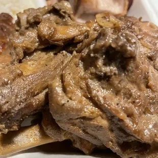 a plate of meat and rice