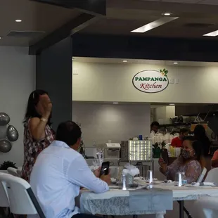 a group of people sitting at a table