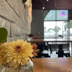 Pleasing aesthetic, fresh flowers and rustic modern lines.