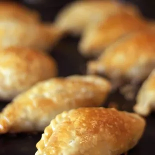 A batch of carne (beef) empanadas.