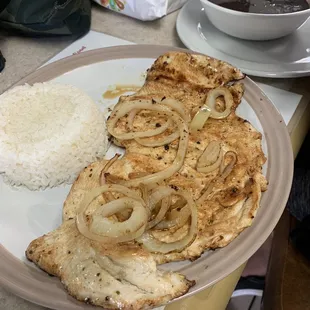 Chicken breast, onions, rice, and beans