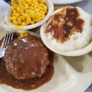 Hamburger Steak with Mac n cheese and mashed potatoes.