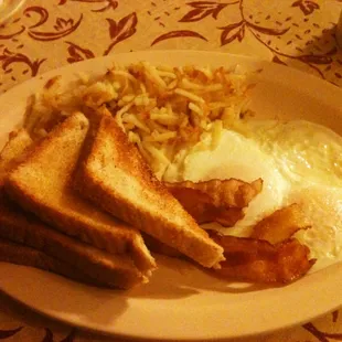 The B2 breakfast. Two eggs, Four strips of bacon, hash browns, and Toast.