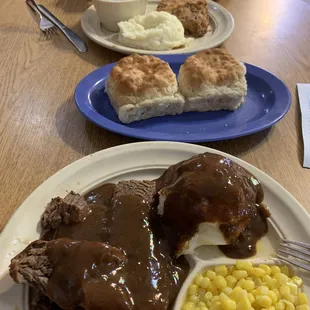 Roast beef, mash potatoes, and buttered corn. Senior chicken fried steak with baked Beans and mashed potatoes.