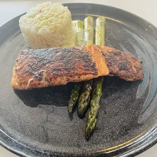 Blackened salmon, asparagus, rice, and mustard sauce.
