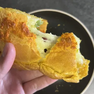 Cheese pull of spicy empanada