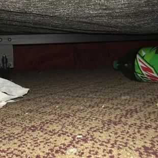 A small portion of the garbage under this bed