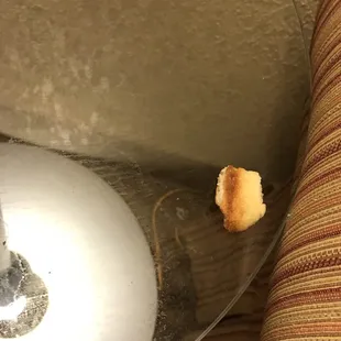Bread on a table with dirty cup rings and spills