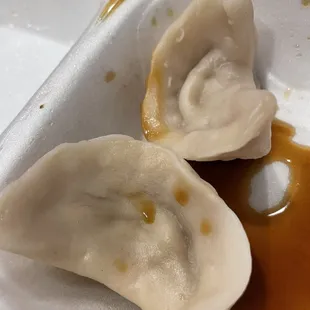 The two steamed dumplings that we didn&apos;t eat. So good!