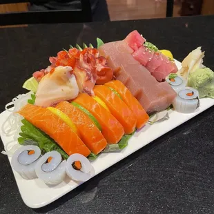 a platter of sushi and sashimi