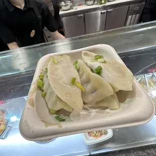 a tray of dumplings on a counter