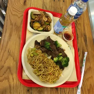 Beef and broccoli with side and water and apple juice