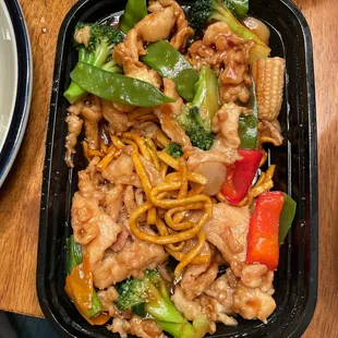 Pan fried noodles with chicken  ;  faint motor oil smell, tastes like something in the sauce spoiled.