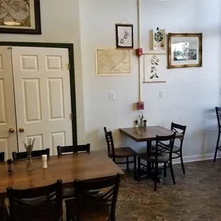 a dining room with tables and chairs