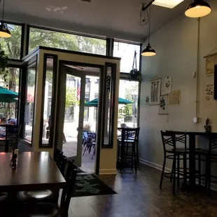 a dining area with tables and chairs