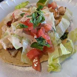 Shark taco, a bit dry. Not sure why the toppings are so chunky.  Needs an improvement.