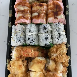 Lobster Tempura Sushi Roll (bottom) Philadelphia Sushi Roll (middle) Valentines roll (top)